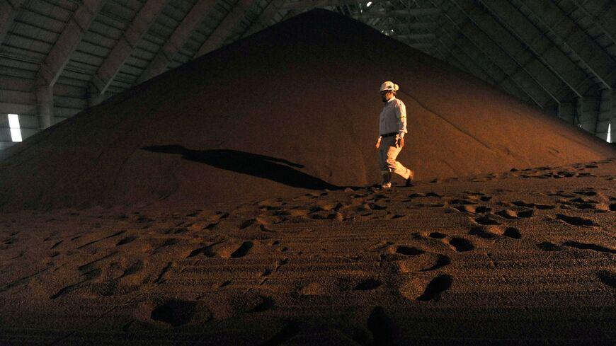 An employee walks in a phosphate storage facility in the Maaden Aluminium Factory near Jubail City, 570 kms east of the Saudi capital Riyadh, on Nov. 23, 2016. - FAYEZ NURELDINE/AFP via Getty Images Read more: https://www.al-monitor.com/originals/2023/04/saudi-arabia-will-mine-minerals-can-it-extract-maximum-added-value#ixzz8EkRldnVe