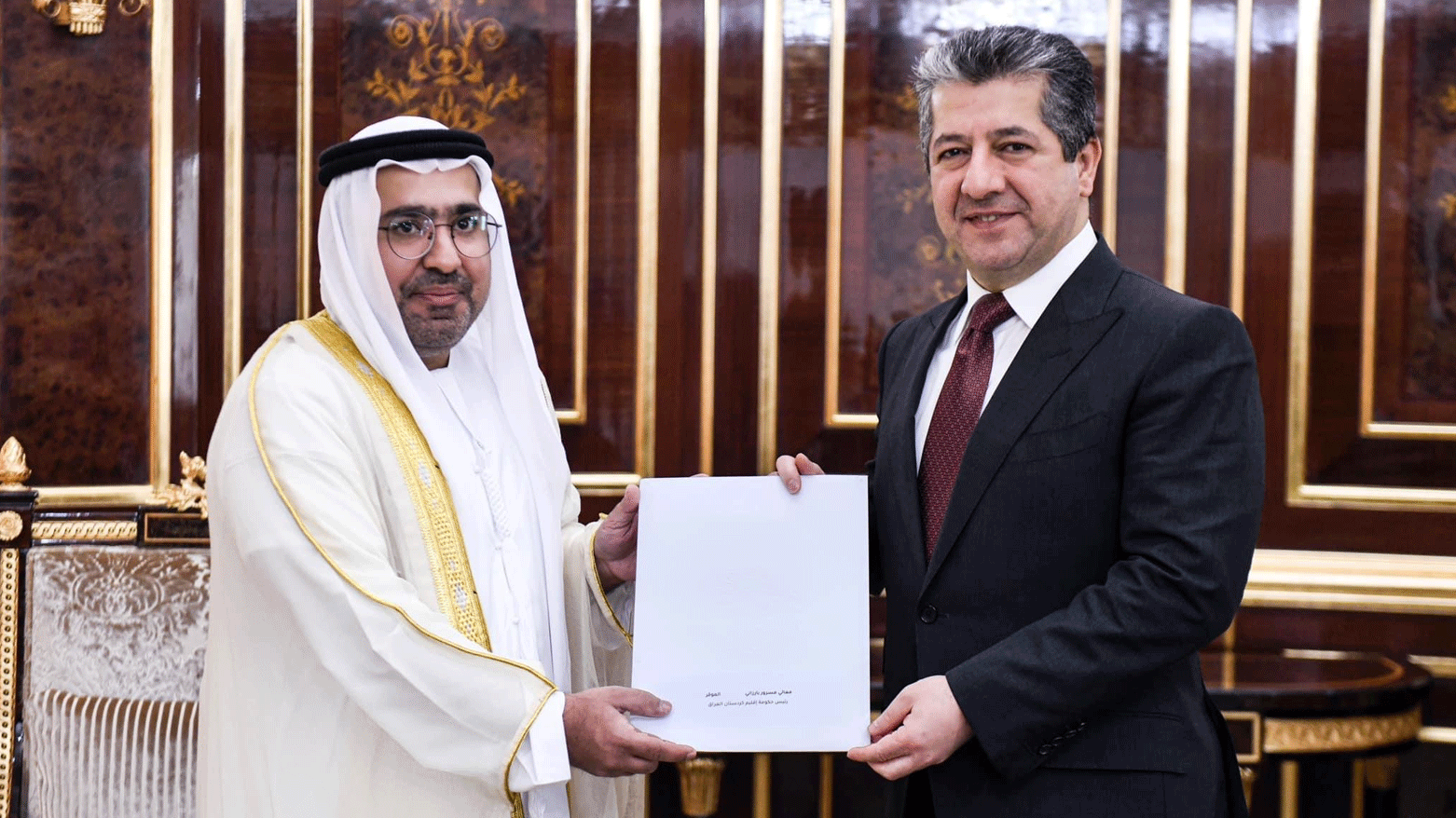 Kurdistan Region Prime Minister Masrour Barzani (right) is pictured while receiving an official invitation letter to attend Cop28 late this year, Oct. 8, 2023. (Photo: KRG)