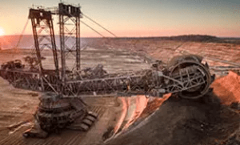 Aerial shot of a large bucket wheel excavator excavating soil in an open pit lignite mine in Germany at sunset. Image used for illustrative purpose. Getty Images Getty Images