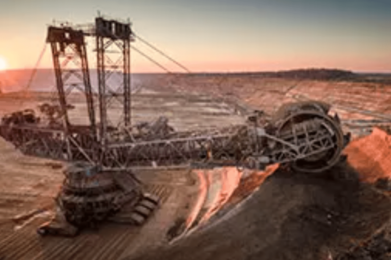 Aerial shot of a large bucket wheel excavator excavating soil in an open pit lignite mine in Germany at sunset. Image used for illustrative purpose. Getty Images Getty Images