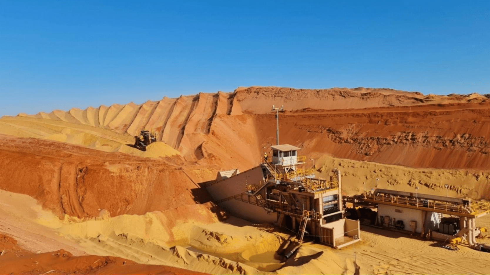 A dozer at the Coburn project push mining of free-flowing sand. Source: Strandline Resources