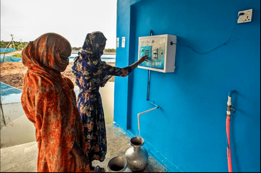 Women collect water using smart devices installed to prevent wastage and enable quick water collection in villages in eastern coastal Bangladesh. All photos- Ledars