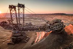 Aerial shot of a large bucket wheel excavator excavating soil in an open pit lignite mine in Germany at sunset. Image used for illustrative purpose. Getty Images Source: Zawya.com