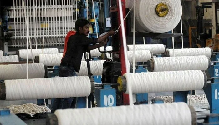 An employee working at a textile factory in Pakistan's port city of Karachi, on April 7, 2011. — AFP Source: Thenews.com.pk