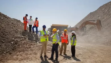 Image used for illustrative purpose. Business people and workers talking in quarry Source: Zawya.com