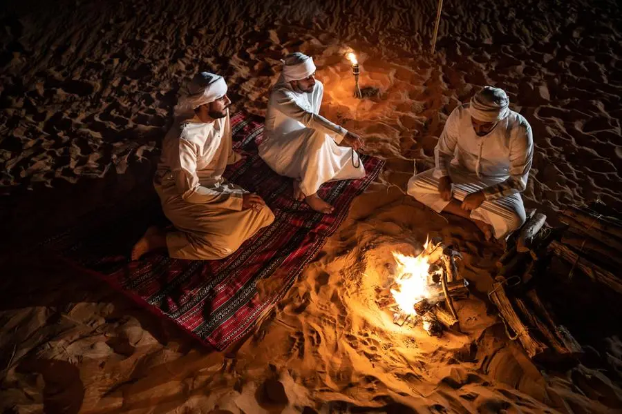 Arabs camping at night in the desert out of Dubai. Getty Images Image used for illustrative purpose. Source: Zawya.com