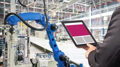 Engineer hand using tablet, heavy automation robot arm machine in smart factory industrial with tablet real time monitoring system application. Industry 4th iot concept. Getty Images/Getty Images Source: Zawya.com