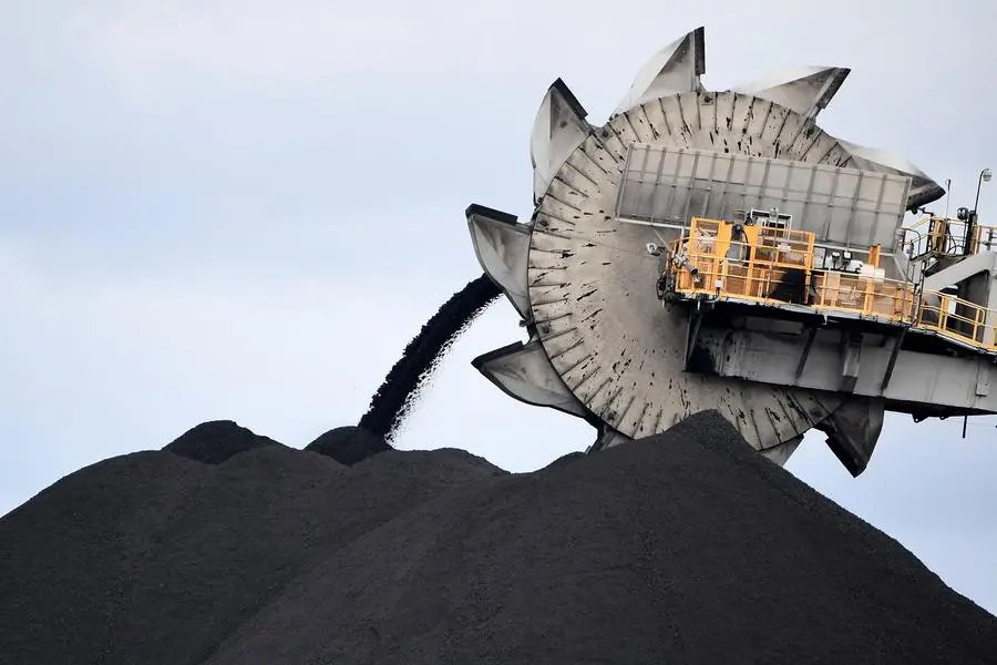 This picture taken on November 5, 2021 shows a bucket-wheel dumping soil and sand removed from another area of the mine in Newcastle, the world's largest coal exporting port. - Australia's conservative leaders have defied calls for urgent climate action, boasting they will sell coal for as long as anyone is buying, but in the country's carbon heartland, locals are already preparing for life beyond fossil fuels. (Photo by Saeed KHAN / AFP) Image used for illustrative purpose. Source: Zawya.com